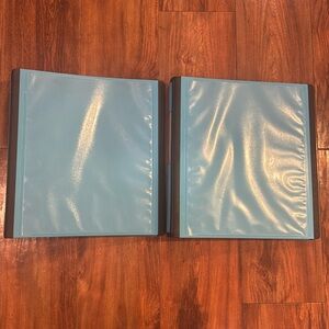 Two binders different sizes with tabs and dividers and labels